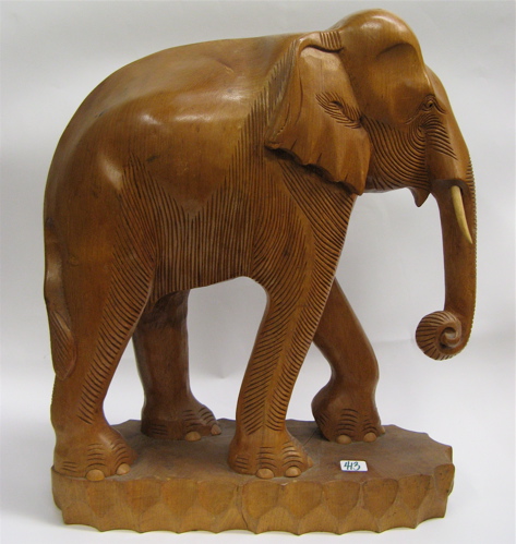 Appraisal: CARVED HARDWOOD ELEPHANT FIGURE standing on wood plinth - H