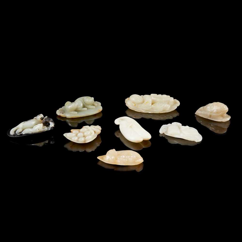 Appraisal: GROUP OF EIGHT JADE PENDANTS comprising a largest celadon jade