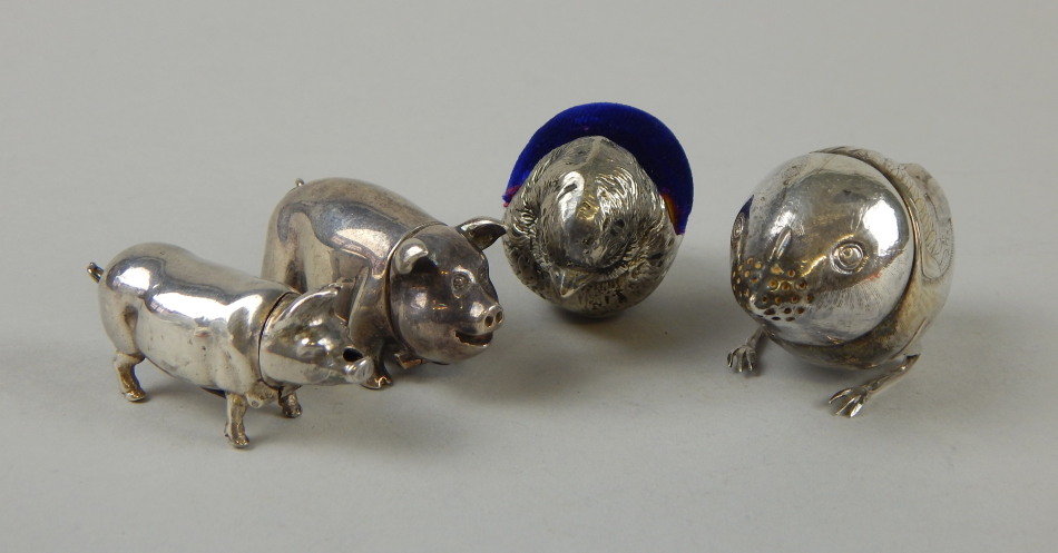 Appraisal: Two silver plated vesta cases modelled as pigs together with