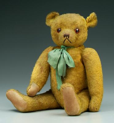 Appraisal: Teddy bear jointed arms and legs slight hump glass eyes