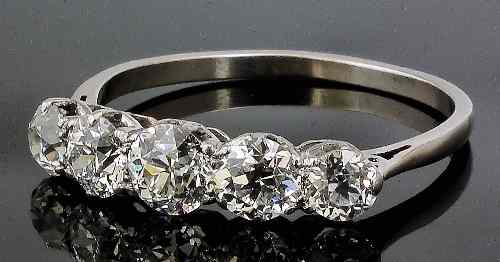 Appraisal: A white metal mounted five stone diamond ring set with