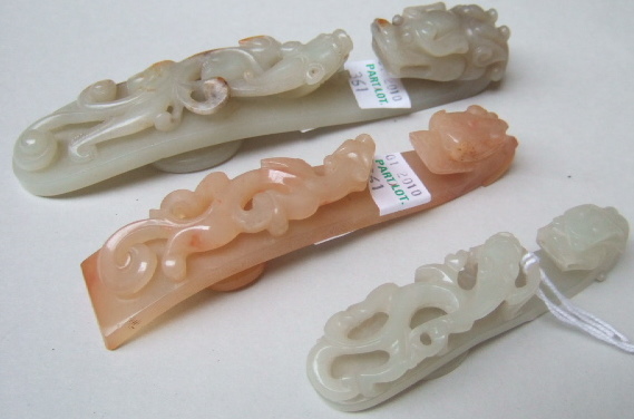 Appraisal: Three jade belthooks each carved and pierced with chilong with