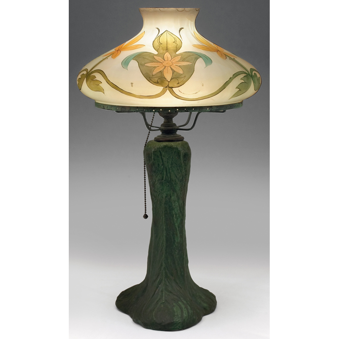 Appraisal: Handel Wheatley lamp Wheatley potterybase with carved peacock feathers coveredin