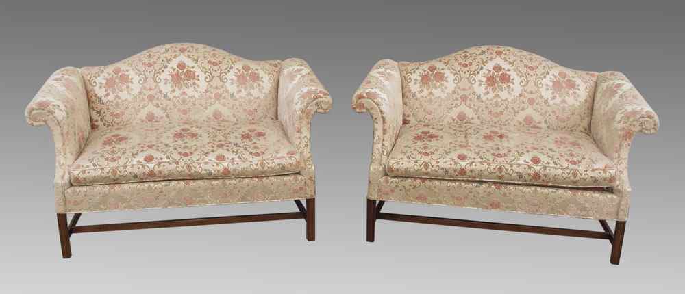 Appraisal: PAIR HICKORY CHAIR CO CAMELBACK SETTEES Floral upholstery Approx ''