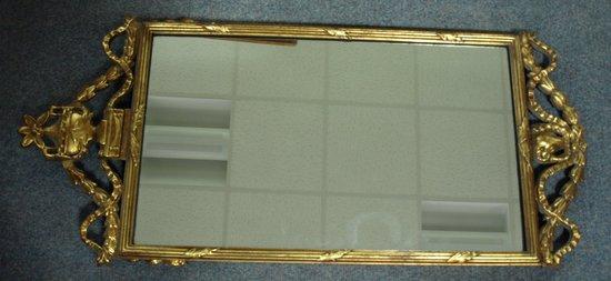 Appraisal: An th Century style gilt framed mirror with urn finial