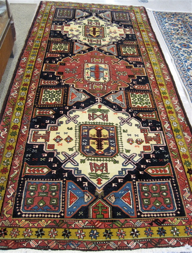 Appraisal: PERSIAN MESHKIN CARPET Ardebil Province northwestern Iran three geometric medallion