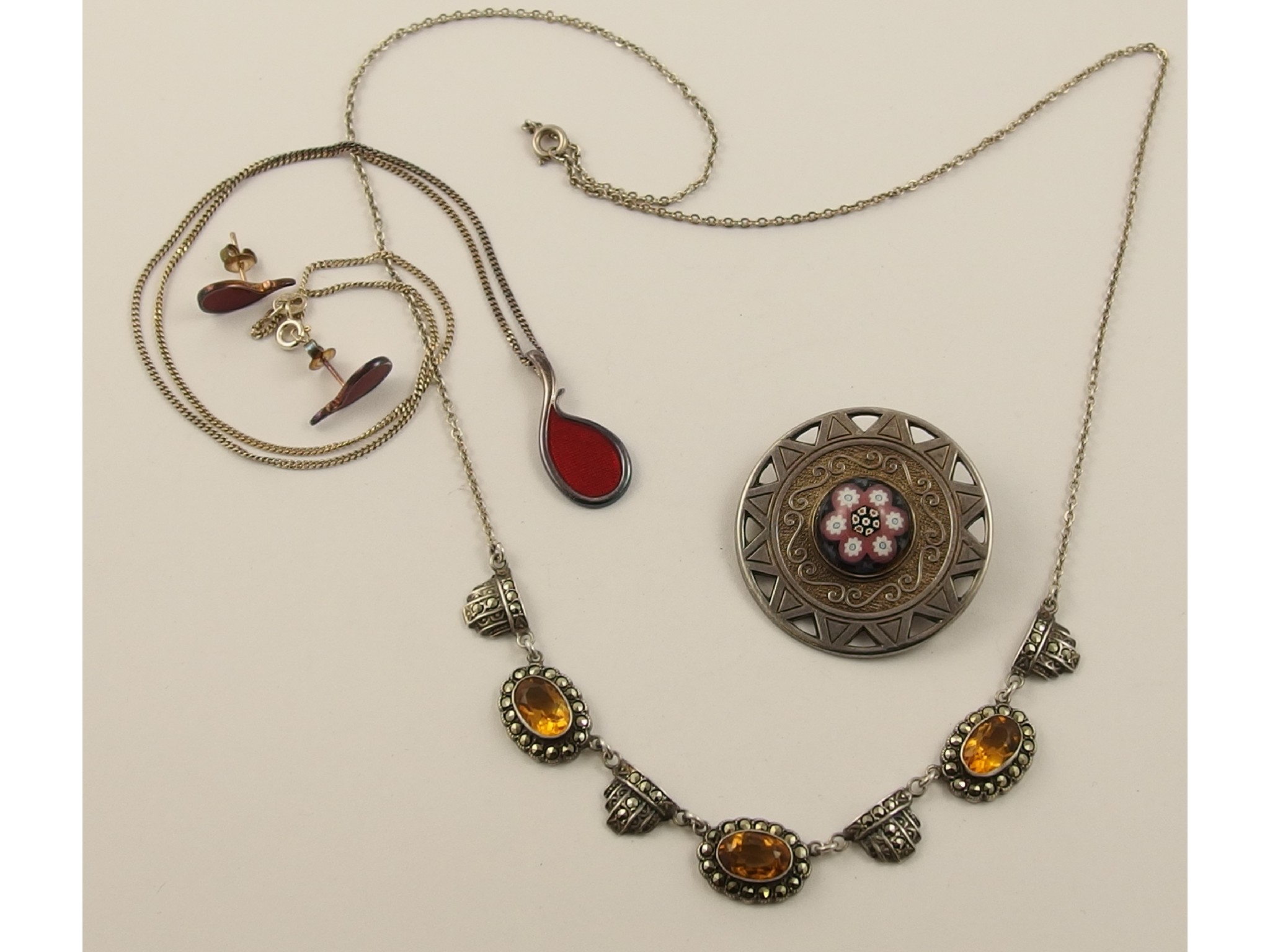 Appraisal: A silver and red enamel Malcolm Gray pendant and earring