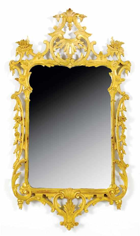 Appraisal: Rococo style giltwood mirror open scrollwork and floral designs surrounding