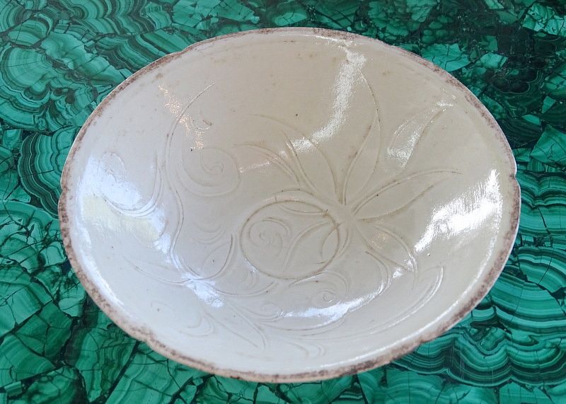 Appraisal: A Chinese White Glazed Molded Flower Bowl A Chinese White