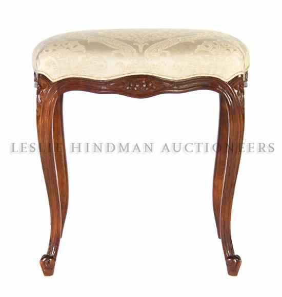 Appraisal: A Louis XV Style Walnut Stool the rectangular upholstered top