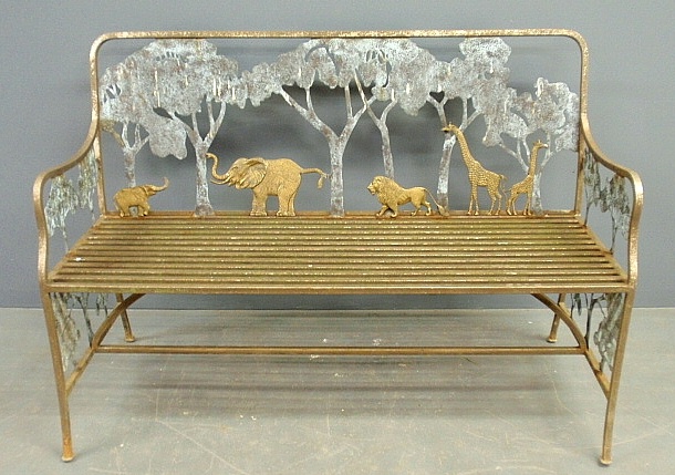 Appraisal: - Wrought iron and brass garden settee decorated with African