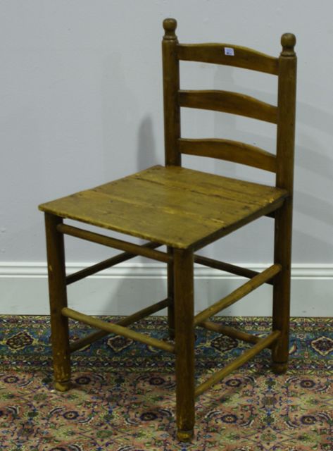 Appraisal: A th century rustic pine ladder back chair