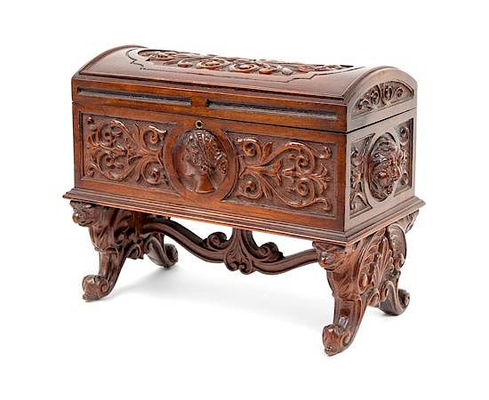 Appraisal: A Continental Carved Walnut Humidor A Continental Carved Walnut Humidor