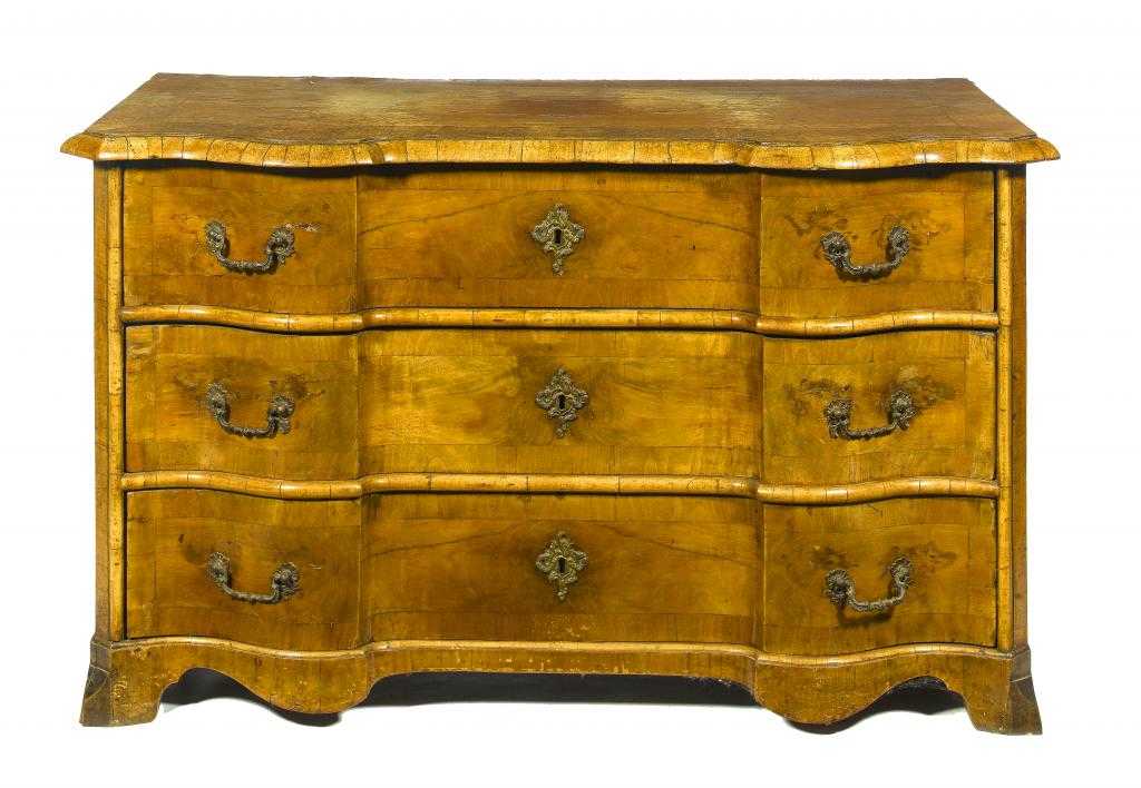 Appraisal: A SOUTH GERMAN WALNUT COMMODE with serpentine moulded and crossbanded