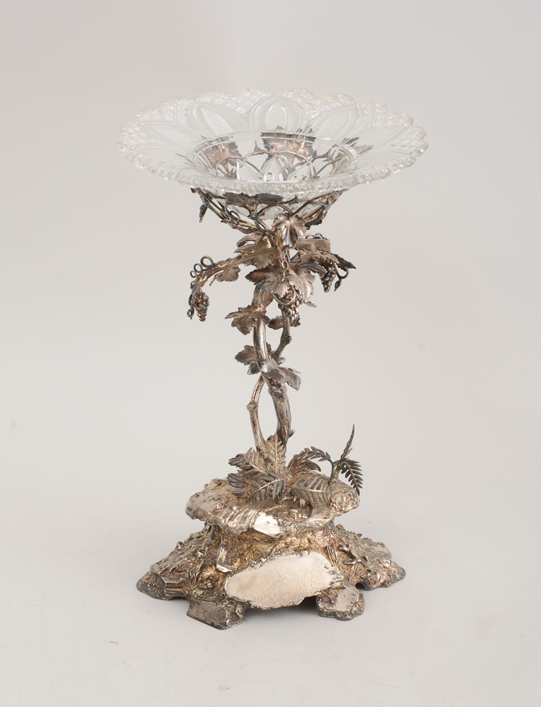 Appraisal: VICTORIAN SILVER-PLATED CENTERPIECE The stem with two intertwined grapevines rising