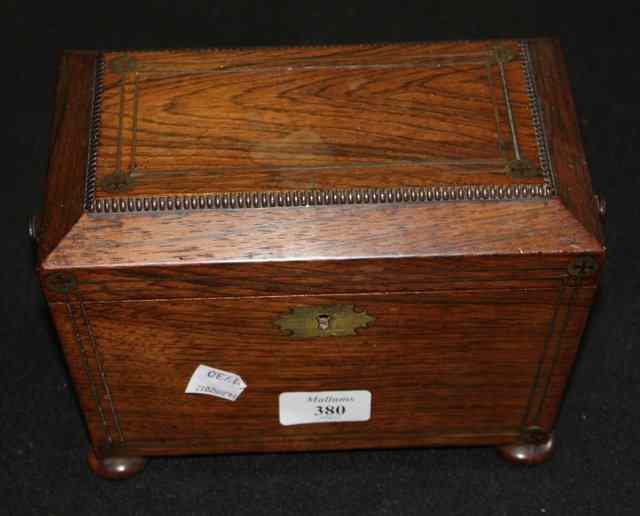 Appraisal: A TH CENTURY ROSEWOOD TEA CADDY of sarcophagus shaped form