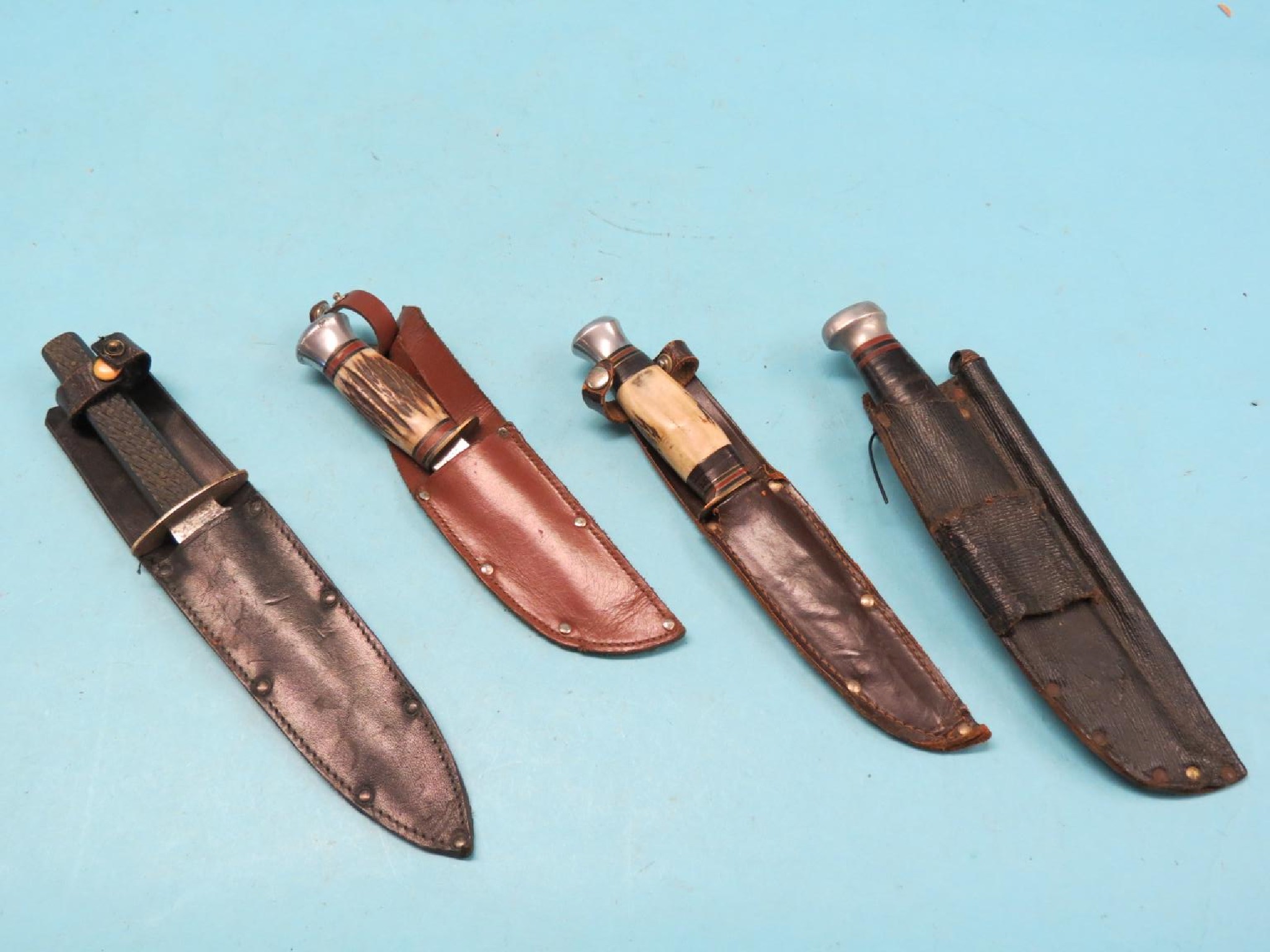 Appraisal: A Rover dagger and three other daggers each within leather