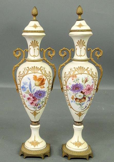 Appraisal: - Pair of signed French porcelain urns with floral decoration