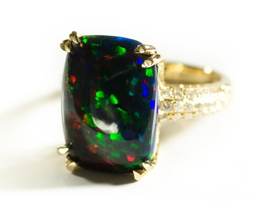 Appraisal: BLACK OPAL DIAMOND AND FOURTEEN KARAT GOLD RING with round-cut