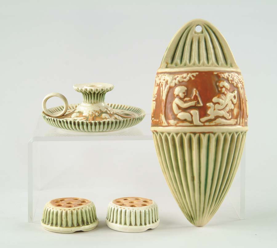 Appraisal: FOUR PIECES OF ROSEVILLE POTTERY Roseville Donatello wall pocket ivory