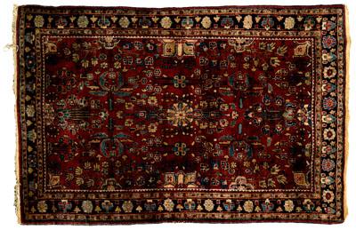 Appraisal: Sarouk rug floral and geometric designs on burgundy field ft