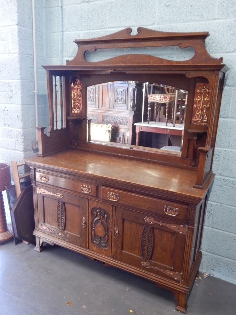 Appraisal: An early thC oak Art Nouveau style sideboard the raised