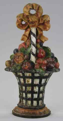 Appraisal: TALL FRUIT BASKET DOORSTOP Large cast iron example depicts heavy