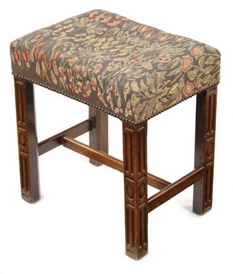 Appraisal: A walnut stool the floral tapestry top above blind fret