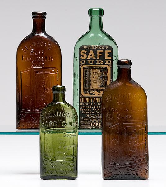 Appraisal: WARNER'S SAFE CURE BOTTLES lot of four Warner's Safe Cure