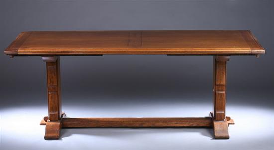 Appraisal: EXPANDING OAK TRESTLE-BASE DINING TABLE th century Molded and reeded-edge