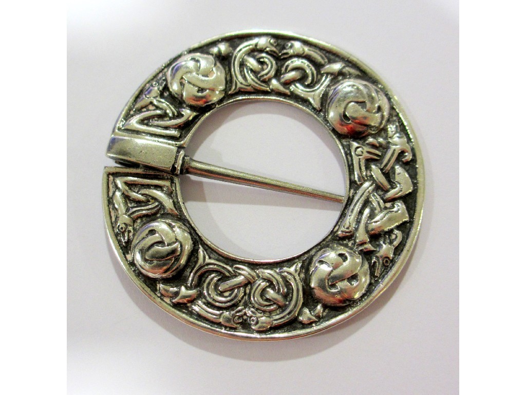 Appraisal: An Alexander Ritchie silver penannular brooch with zoomorphic decoration between