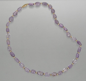 Appraisal: A Fluorite and Gold Bead Necklace The necklace consists of