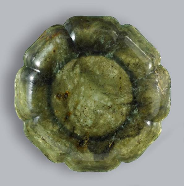 Appraisal: A Chinese 'spinach' jade floriform dish th Century Thinly sectioned