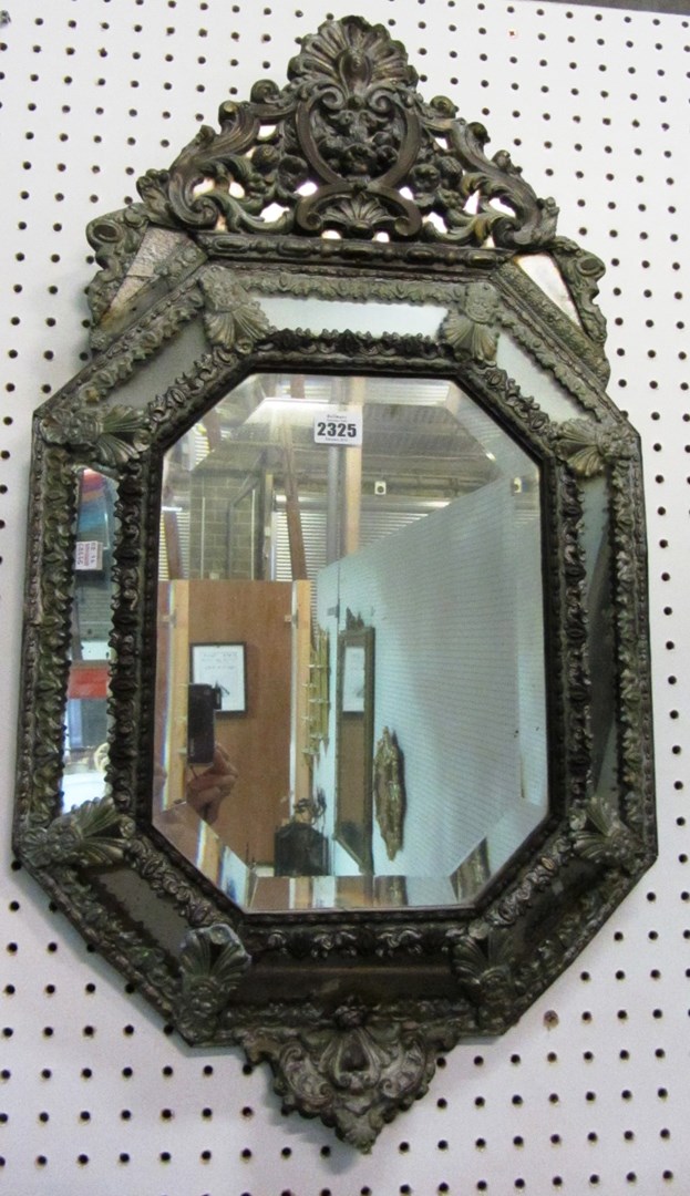 Appraisal: A th century mirror with nine bevelled panels and a