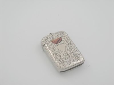 Appraisal: A Edwardian combined vesta and stamp case with scroll engraving