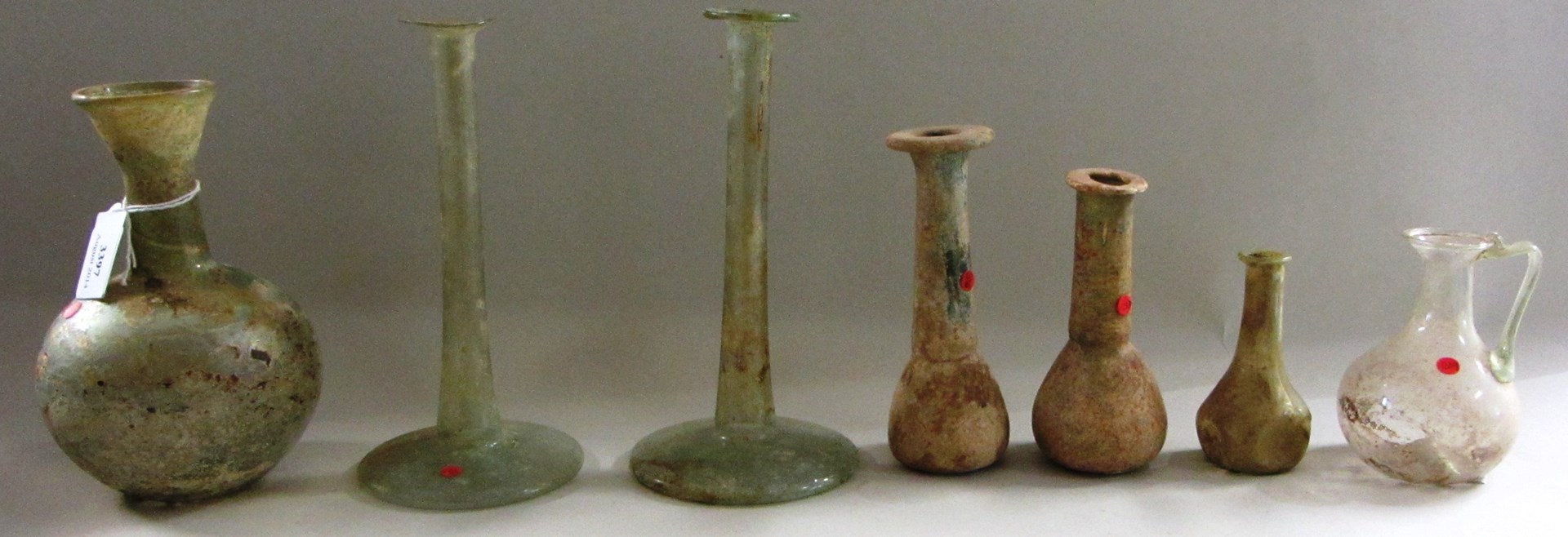 Appraisal: Seven Roman green glass vessels circa rd- th century A