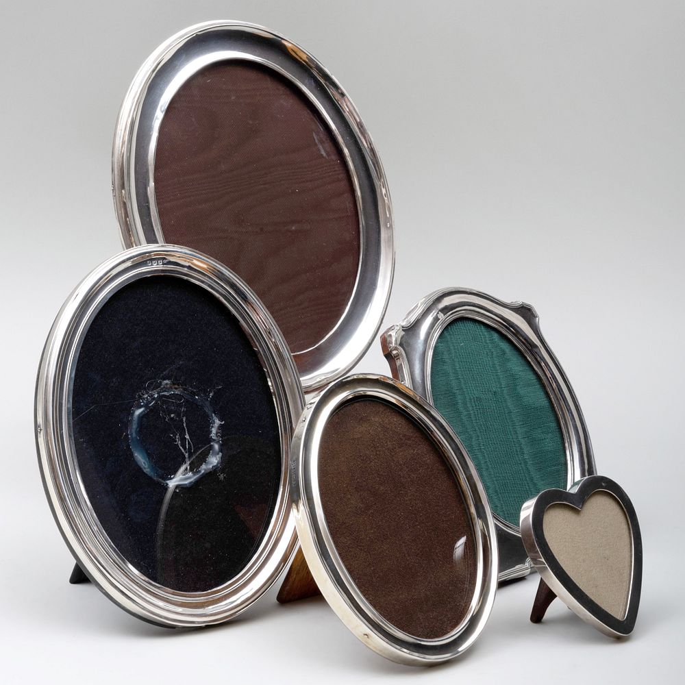 Appraisal: Five Silver Picture Frames Comprising A small heart shaped frame