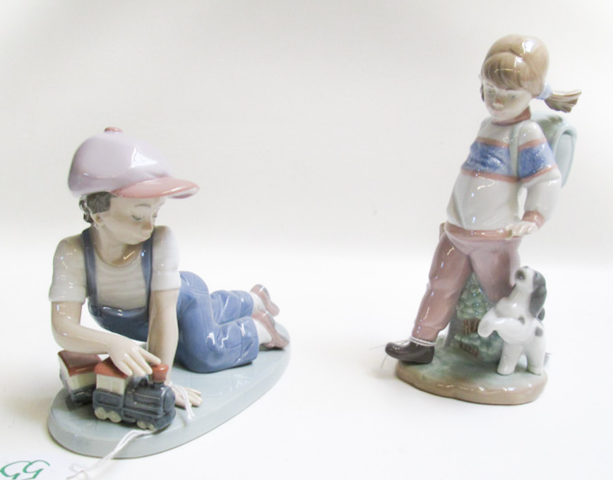 Appraisal: TWO LLADRO PORCELAIN FIGURINES All Aboard by sculptor Antonio Ramos