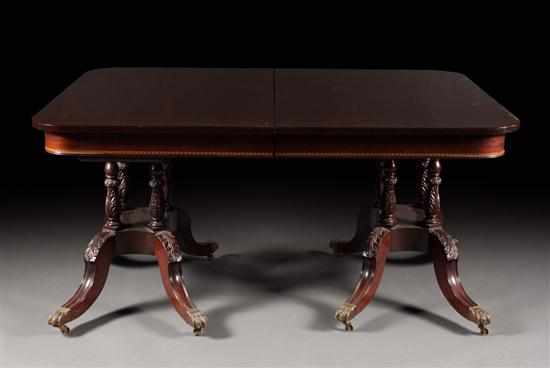 Appraisal: Potthast Brothers Federal style carved mahogany double pedestal dining table