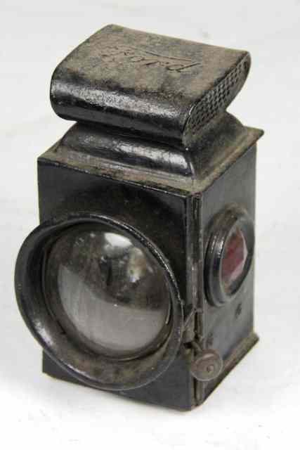 Appraisal: A Ford commercial ebonised lamp with red side glasses cm