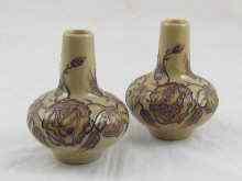 Appraisal: A pair of Moorcroft squat vases the fawn bodies with