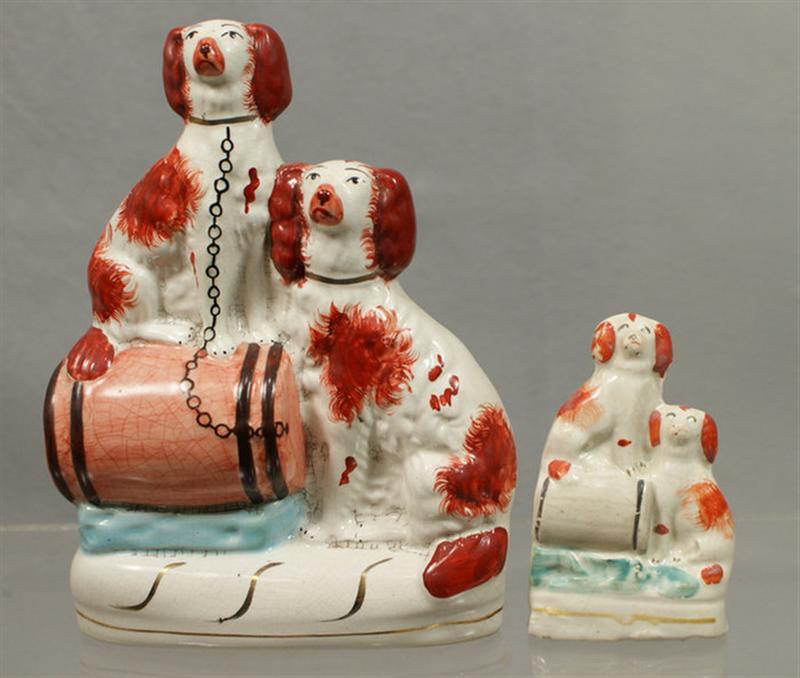 Appraisal: Staffordshire rust spaniels on keg figure craquelure h h Estimate