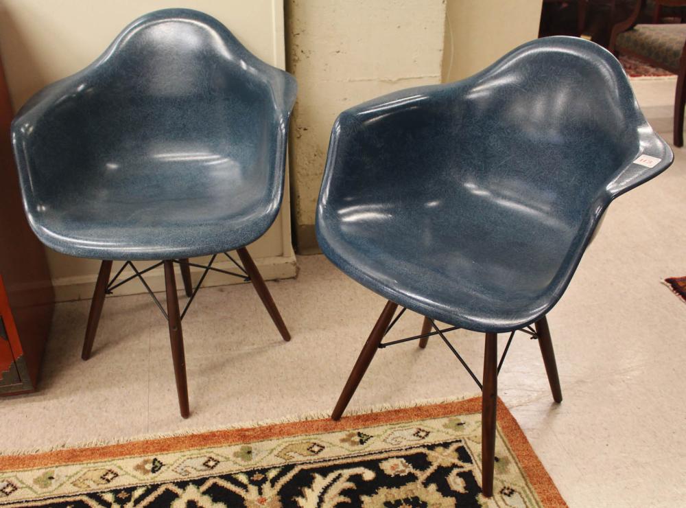 Appraisal: A PAIR OF BLUE 'CASE STUDY' FIBERGLASS SHELL SWIVEL ARMCHAIRS