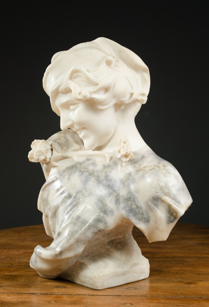 Appraisal: MARBLE AND ALABASTER BUST Italian c s a smiling young