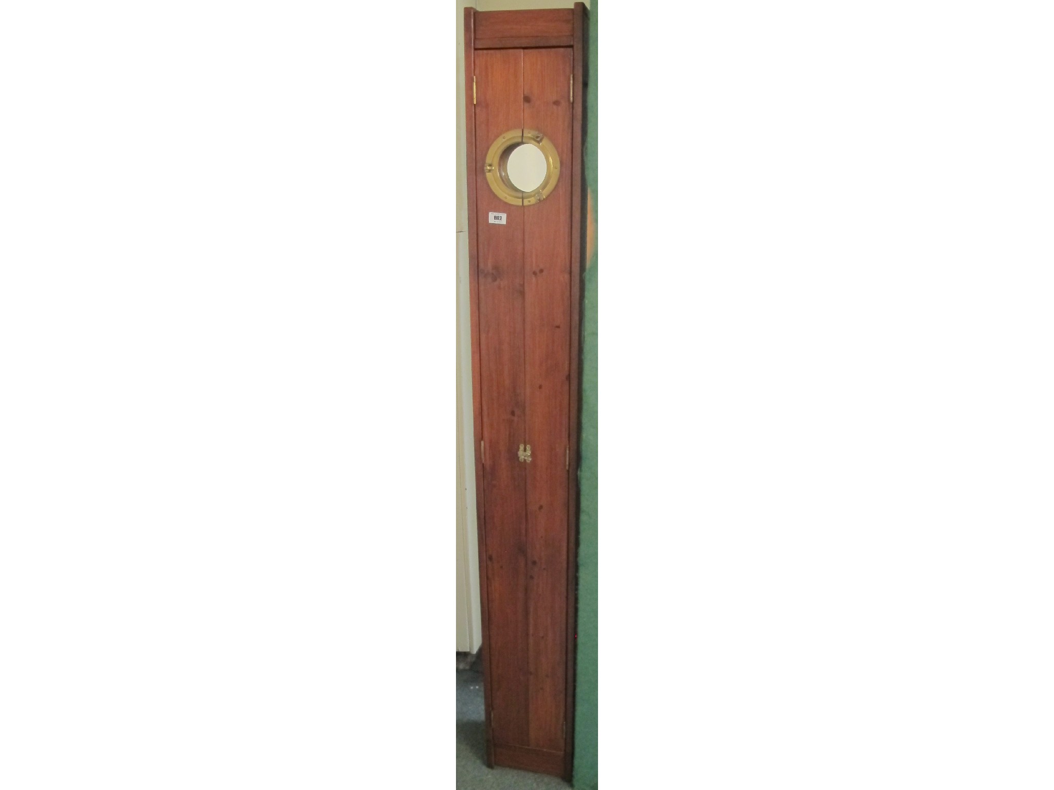 Appraisal: A contemporary hardwood locker with brass decoration