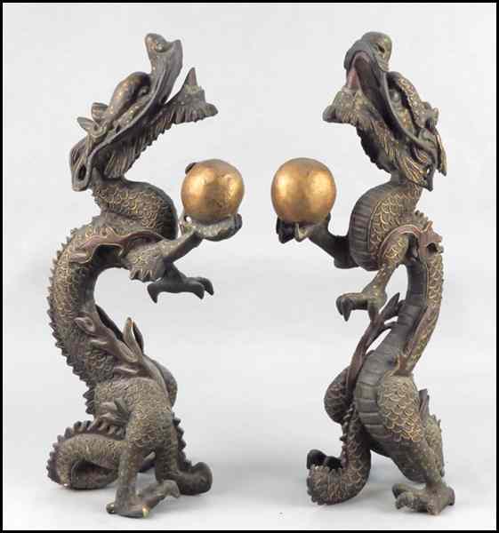 Appraisal: PAIR OF CARVED WOOD AND PARCEL GILT STANDING DRAGONS Height