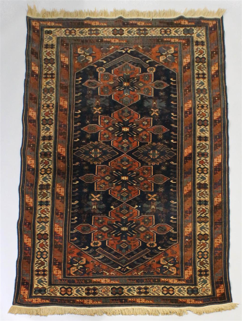 Appraisal: PERSIAN GASGHAI WOOL RUG having four medallions on a deep