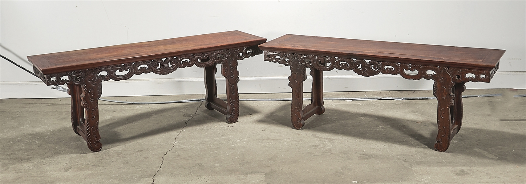 Appraisal: Pair of Chinese low hard wood tables with carved apron