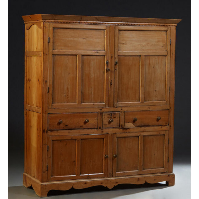 Appraisal: Continental Pine Cupboard th c the sloping crown over a