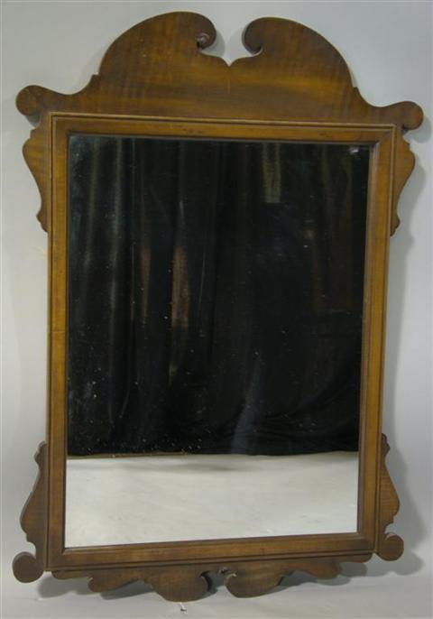 Appraisal: CHIPPENDALE STYLE MAPLE MIRROR The shaped frame enclosing a rectangular